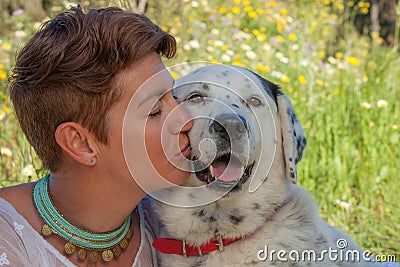 Woman kissing pet rescue dog Stock Photo