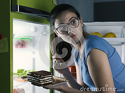 Woman having a late night snack Stock Photo