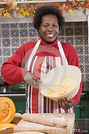 Woman in kitchen making Halloween treats Stock Photo