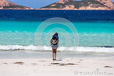 Woman in a kitty hoodie standing on the Lucky Bay beach in Western Australia Stock Photo