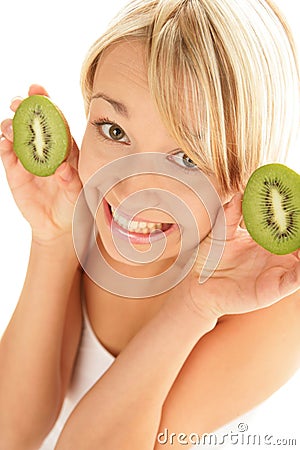 Woman with kiwi halves Stock Photo