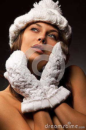 Woman in knit white mittens and cap Stock Photo