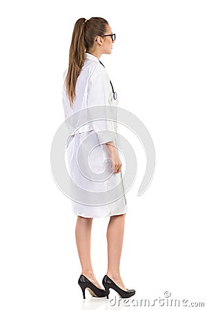 Woman In Lab Coat, Side, Rear View Stock Photo
