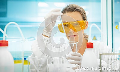 Woman in lab with equipments, pipettes Stock Photo