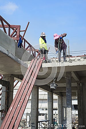 Woman labor in construction site. Stock Photo