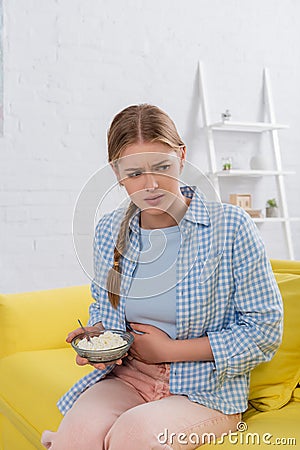 Woman with lactose intolerance holding plate Stock Photo