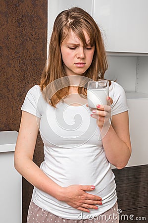 Woman with lactose problem is suffering from stomach pain Stock Photo