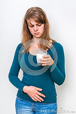 Woman with lactose problem is suffering from stomach pain Stock Photo