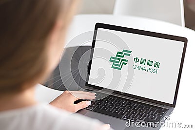 Woman with laptop - China Post logo Editorial Stock Photo