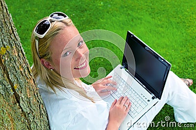 Woman with laptop computer Stock Photo