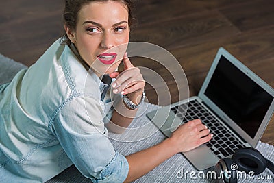 Woman with a laptop at her home Stock Photo