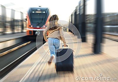 Woman late from train. Tourist running and chasing. Stock Photo