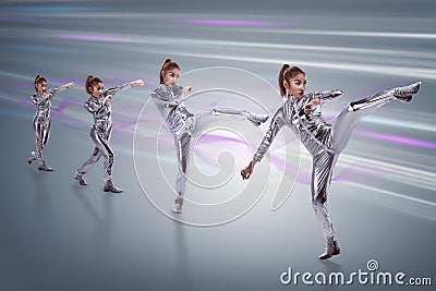 Woman in latex suit with fight stance Stock Photo