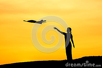 Woman launches toy plane. Stock Photo
