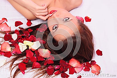 Woman laying in a bed Stock Photo