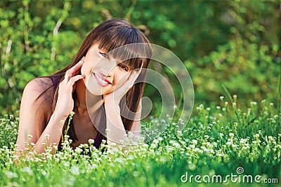 Woman laying grass Stock Photo