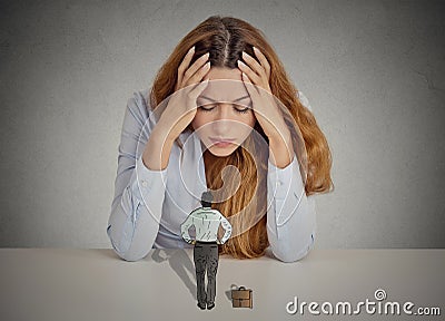 Woman leaning on a desk bossy executive man patronizing her Stock Photo