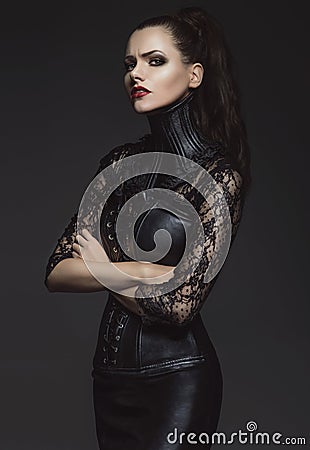 Woman in leather clothes Stock Photo