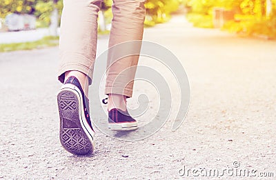 Woman legs gumshoes Stock Photo