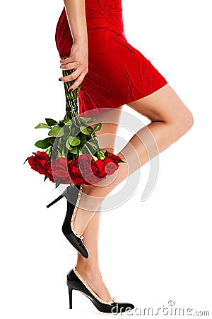 Woman Legs Red Dress and Flowers Roses Bouquet, Beautiful Girl in High Heels Shoes on White Stock Photo