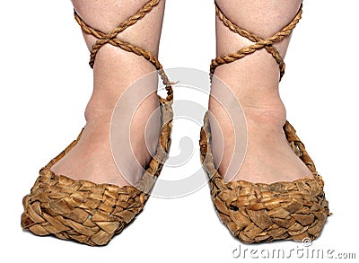 Woman legs in russian bast shoes Stock Photo