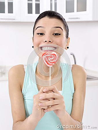 Woman licking sweet sugar candy Stock Photo