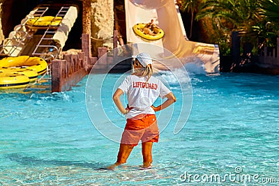 Woman lifeguard on the swimming pool. Tourism and travel, vacation Editorial Stock Photo