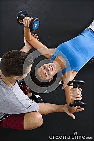 Woman lifting weights Stock Photo