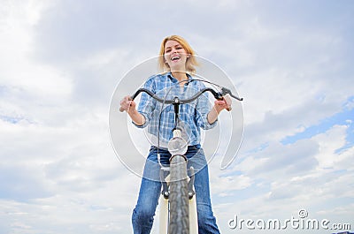 Woman likes to ride bike. Girl enjoy short cycle tour with stop offs along way and travel. Girl holds handlebar of bike Stock Photo