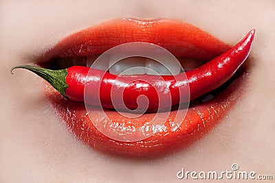 Woman lips and chili pepper Stock Photo
