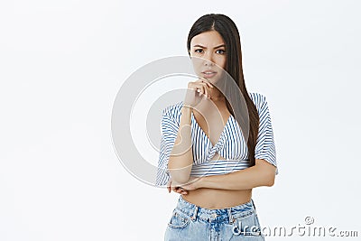 Woman listeing carefully trying understand plan. Portrait of smart and creative focused stylish female entrepreneur in Stock Photo