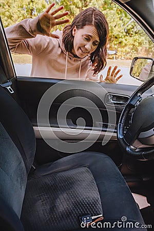 woman locked car and forget keys inside Stock Photo
