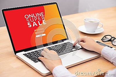 Woman login with password on laptop computer for shopping online website with promotion sale discount campaign on screen. Stock Photo