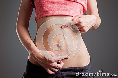 Woman with long abdominal scars after operation Stock Photo