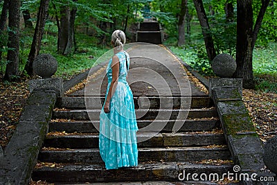 Lady in a dark mystical haunted forest. Forest Fairy Stock Photo