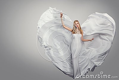 Woman Long White Dress, Fluttering Wings as Heart, Fashion Model Waving Flying Gown, Beauty Portrait Stock Photo