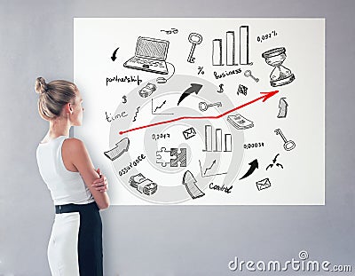 Woman looking at business sketch Stock Photo