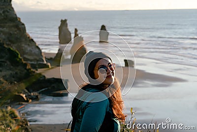 Woman looking at the camera on beautiful seaside landscape Stock Photo