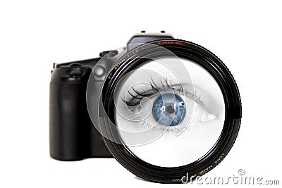 Woman Looking Through a Camera Lens Stock Photo