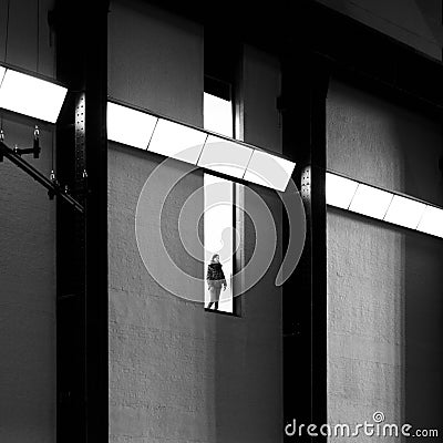 Woman looking at the engine room at the Tate Modern. London, 2017. Editorial Stock Photo