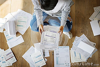 Woman looking at the house bills Stock Photo