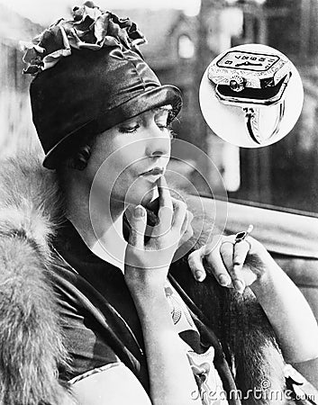 Woman looking at a watch ring Stock Photo