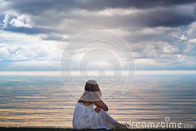 Woman looks at colorful light reflections Stock Photo