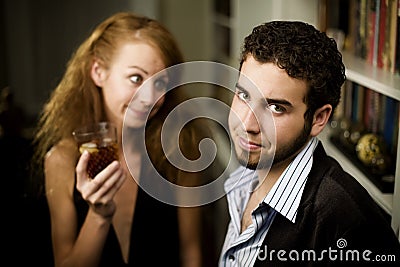 Woman looks lovingly at young man Stock Photo