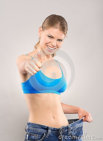 Woman loosing weight Stock Photo