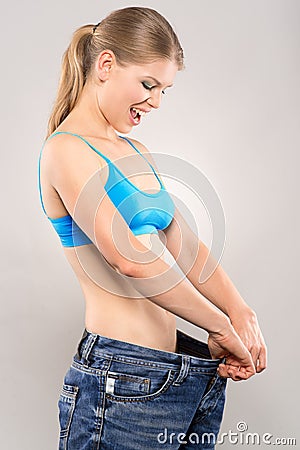 Woman loosing weight Stock Photo