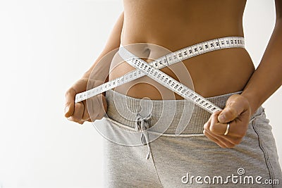 Woman losing weight Stock Photo