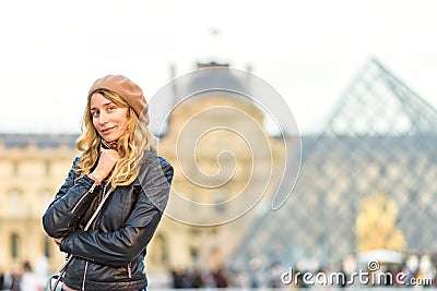 Woman at Louvre in Paris, France. Young tourist girl admiring the views. French style. Portrait soft bokeh backgrounds Editorial Stock Photo