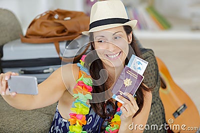 woman with luggage in loft apartment waiting for departure Stock Photo