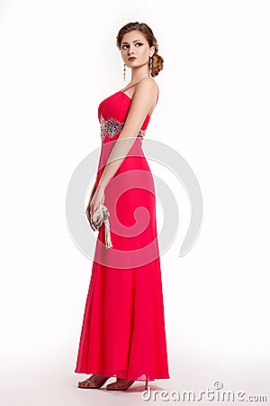 Woman in luxury red long dress with handbag Stock Photo